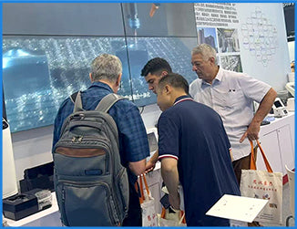 Filazoo team discussing 3D printing solutions with visitors at an international trade show
