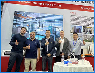 Group photo of Filazoo team and international clients at a professional 3D printing exhibition