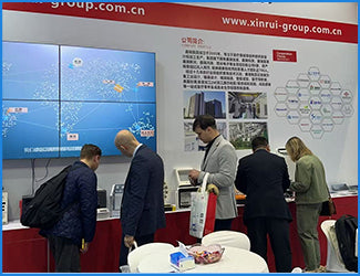 Visitors engaging with Filazoo products and technical displays at an international trade event