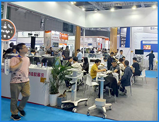 Visitors exploring Filazoo booth and learning about 3D printing materials at a trade exhibition