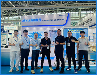 Filazoo exhibition team posing at a global manufacturing and technology trade show