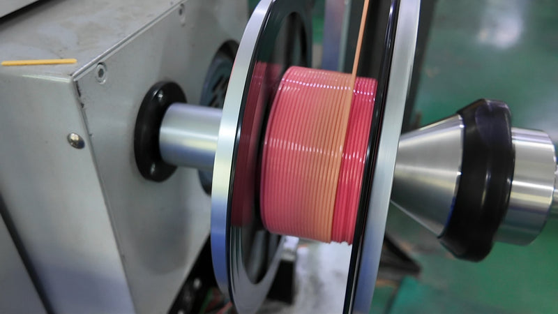 Close-up of filament spooling process during quality-controlled production at Filazoo factory