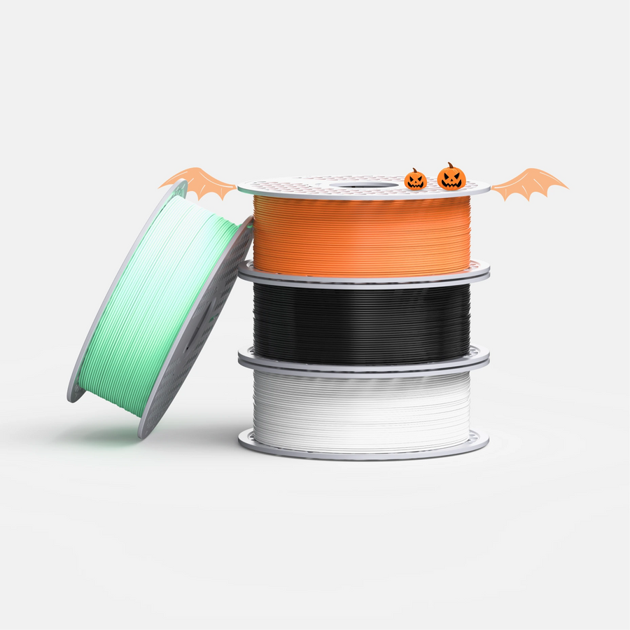 Pumpkin Halloween PLA filament bundle with orange, black, white, and glow green
